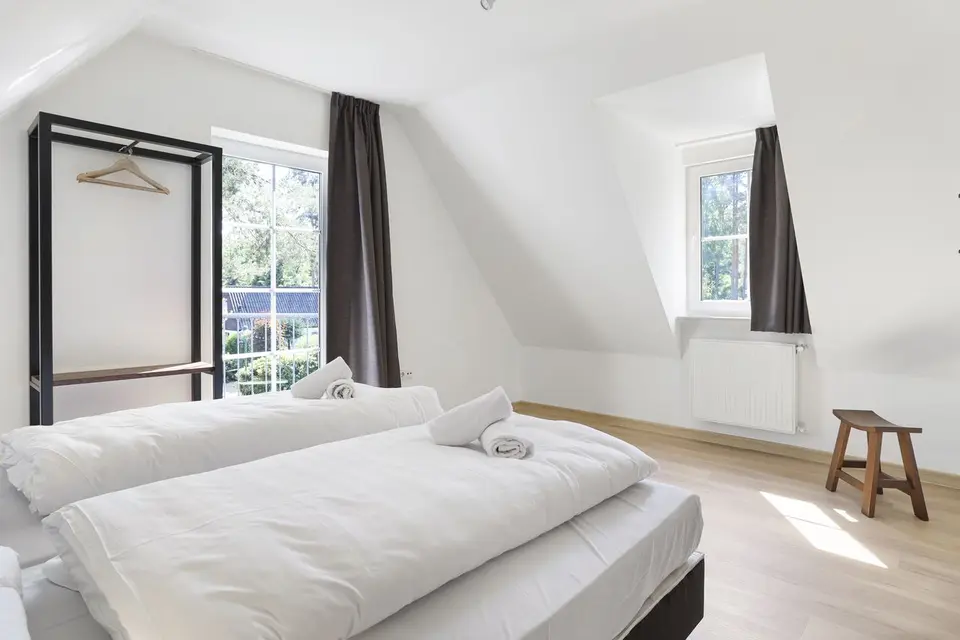 Slaapkamer van een vakantiehuis op Dwergter Sand